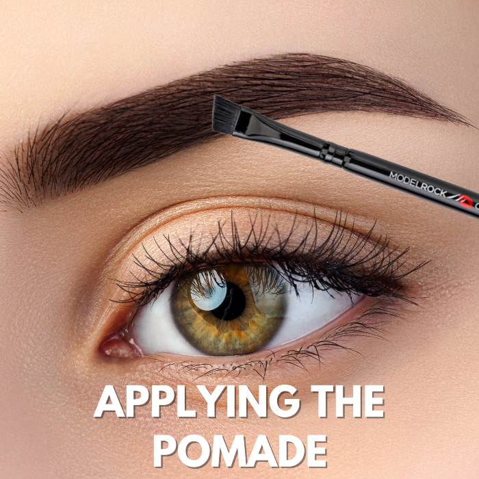 Applying eyebrow pomade