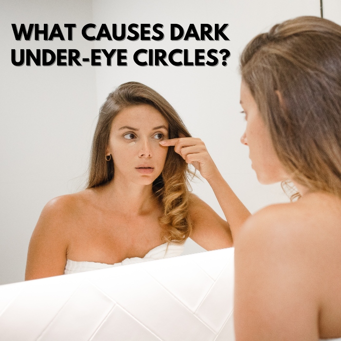 girl looking at under-eye circles