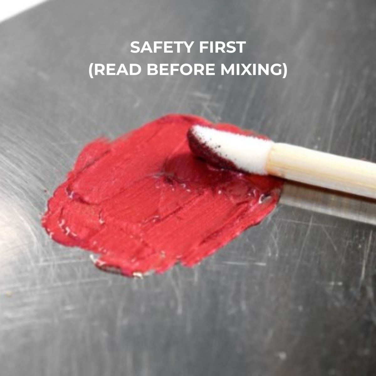 Red lip gloss being spread.