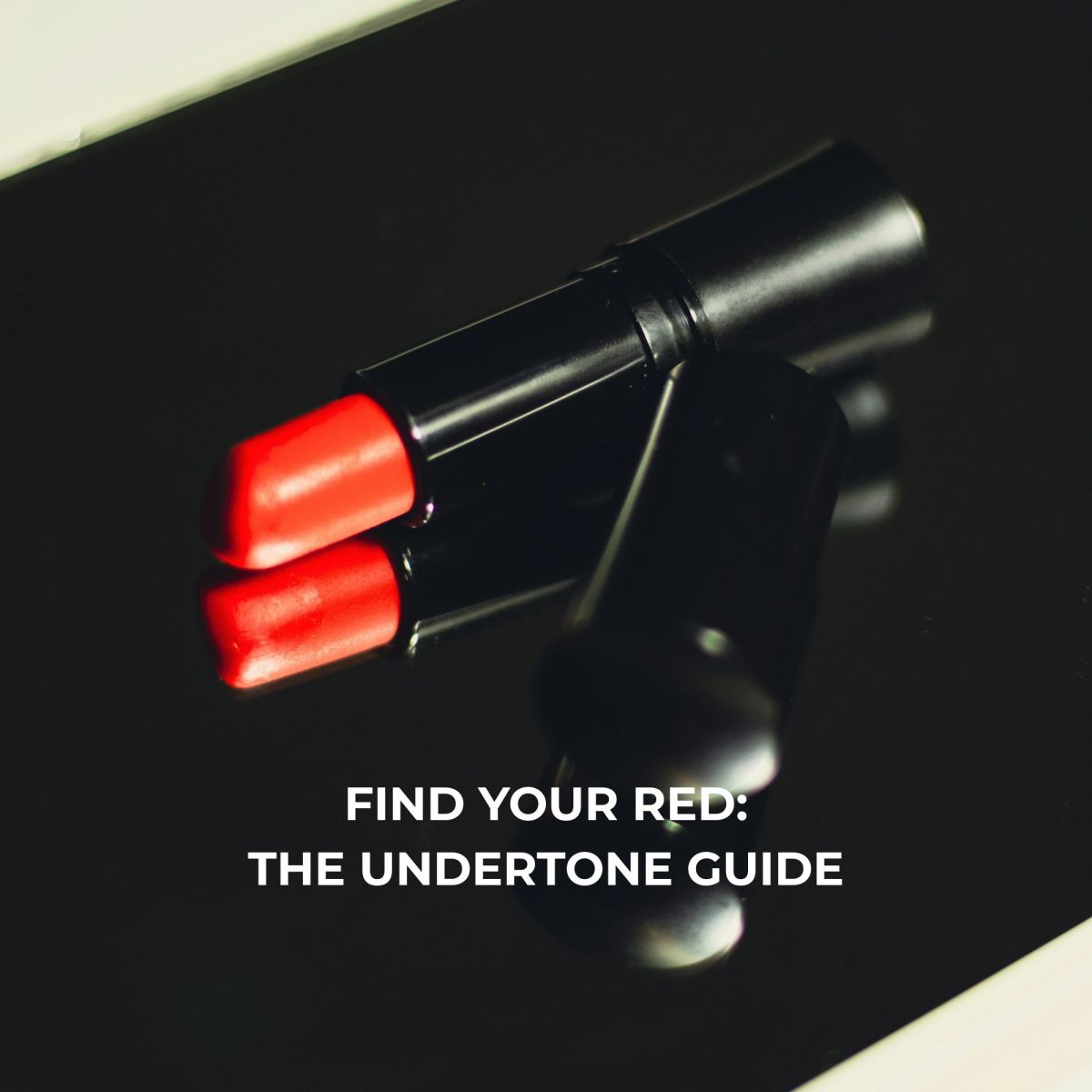 Red lipstick on a black surface